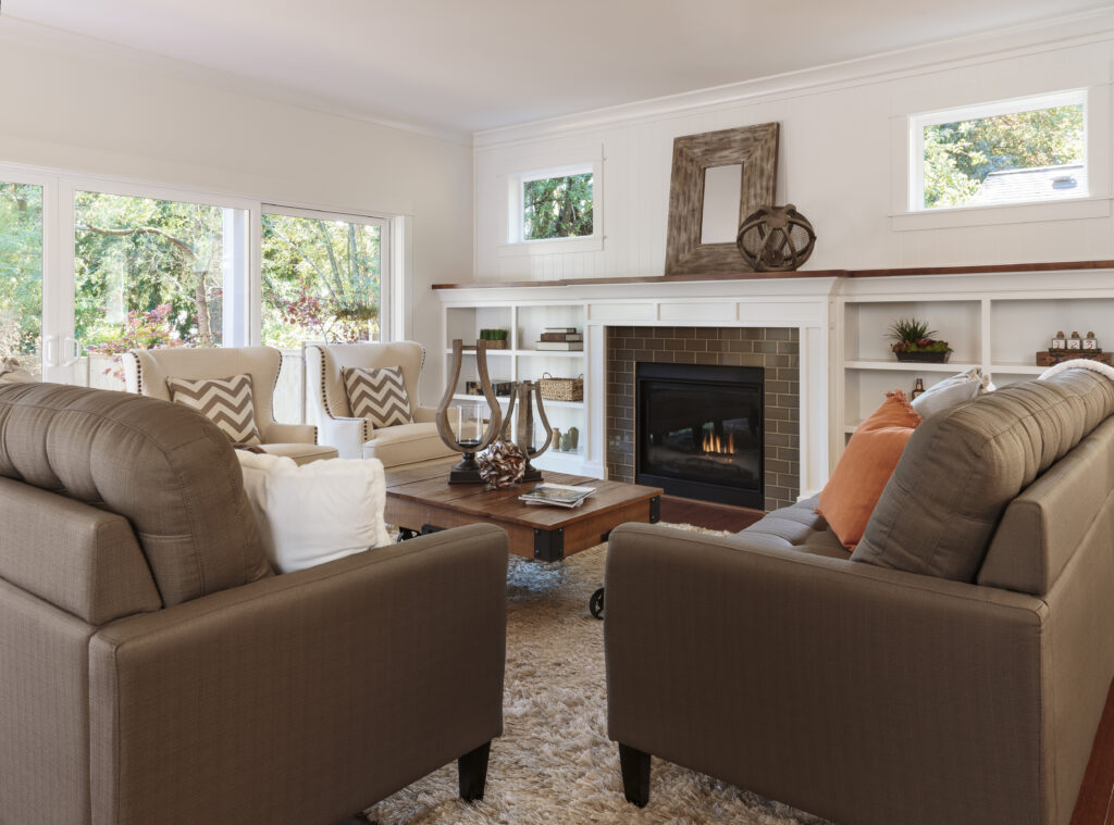 Quiet, home-like living room with sofas and armchairs, the kind of setting a small residential program offers
